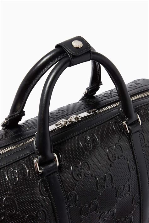 gucci embossed duffle bag